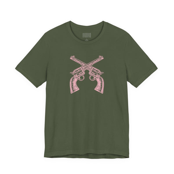 Green outlaw t shirt with pink vintage crossed pistols graphic on front, unisex cotton tee with western outlaw style