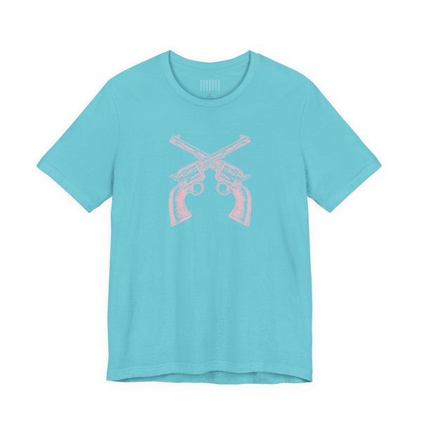 Light blue outlaw t shirt with pink vintage crossed pistols graphic and unisex fit