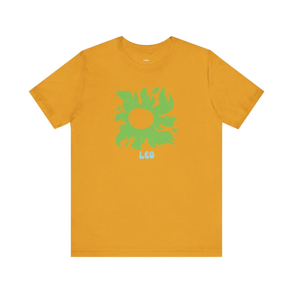 Mustard yellow Leo astrology t shirt with a green sunburst graphic and star accents, made of soft cotton.