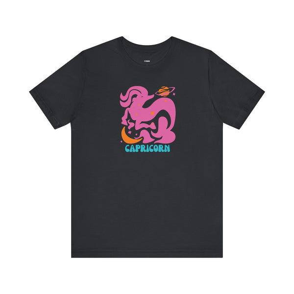 Black astrology t shirt with vibrant pink Capricorn sea-goat graphic and turquoise planetary accents, astrology zodiac tee.