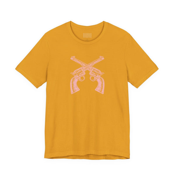Mustard yellow outlaw t shirt with vintage style pink crossed pistols graphic on front.