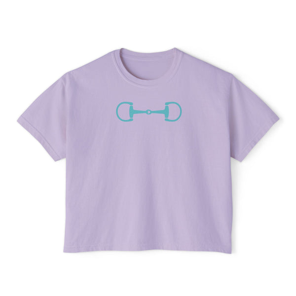Light purple boxy tee shirt with aqua horsebit graphic, modern equestrian streetwear style.