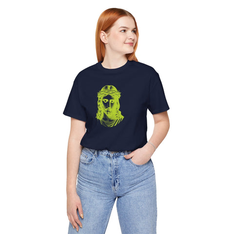 Woman wearing navy christian graphic t-shirt with bold lime green Jesus face design and blue jeans