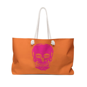 Orange weekender bag with neon pink skull graphic and white cotton rope handles