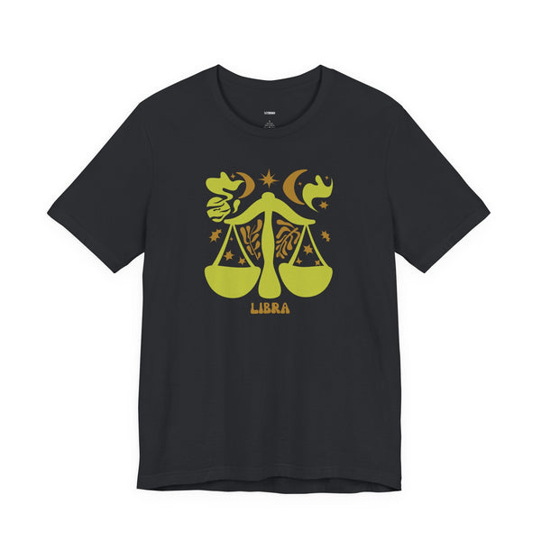 Black Libra t shirt with artistic yellow-green zodiac balance scales and celestial design.