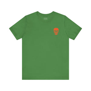 green unisex t-shirt with small orange skull graphic on left chest side