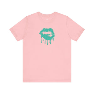 Pink unisex t-shirt featuring a teal vampire lips graphic with dripping effect on the front.
