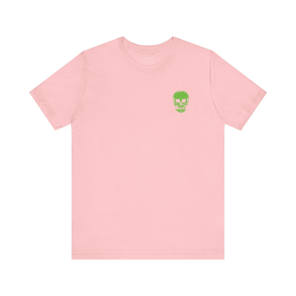 Pink tee with green mini skull front graphic, ideal for music festival fashion and street style.