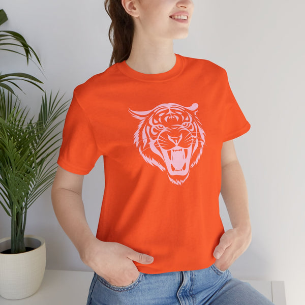 Woman wearing orange t-shirt with pastel pink roaring tiger head graphic design