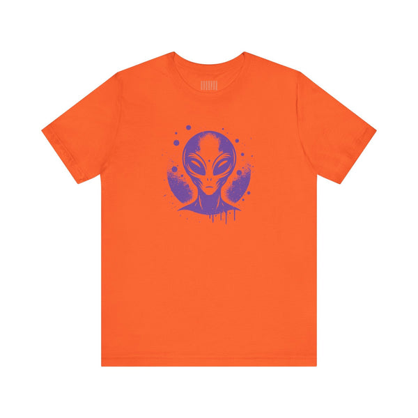 Orange streetwear alien t shirt with a purple alien graphic inspired by 1980s sci-fi and street art.
