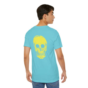 Man wearing light blue graphic tee with large yellow skull print on back from FUGITIVE TEES