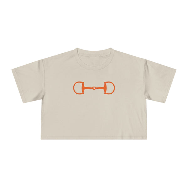 Equestrian style beige cropped top with bold orange horsebit graphic for horse lovers and riders