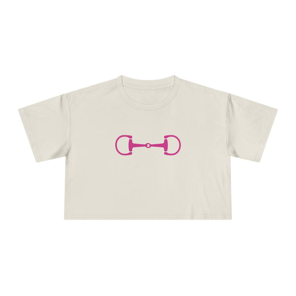 Cropped white tee with pink horsebit graphic and relaxed fit in modern equestrian style