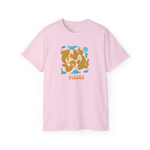 Light pink Pisces t shirt with artistic fish graphic and Pisces text in orange and blue accents