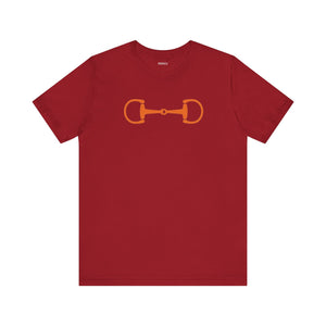 Red graphic tee with orange horsebit design, heritage equestrian streetwear style.