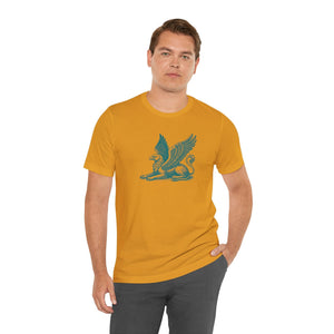 Man wearing mustard yellow tee with teal gryphon guardian graphic, mythical design from Fugitive Tees collection