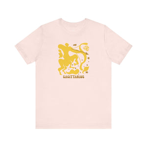 Sagittarius Zodiac graphic tee with mustard-yellow centaur archer design on light pink background