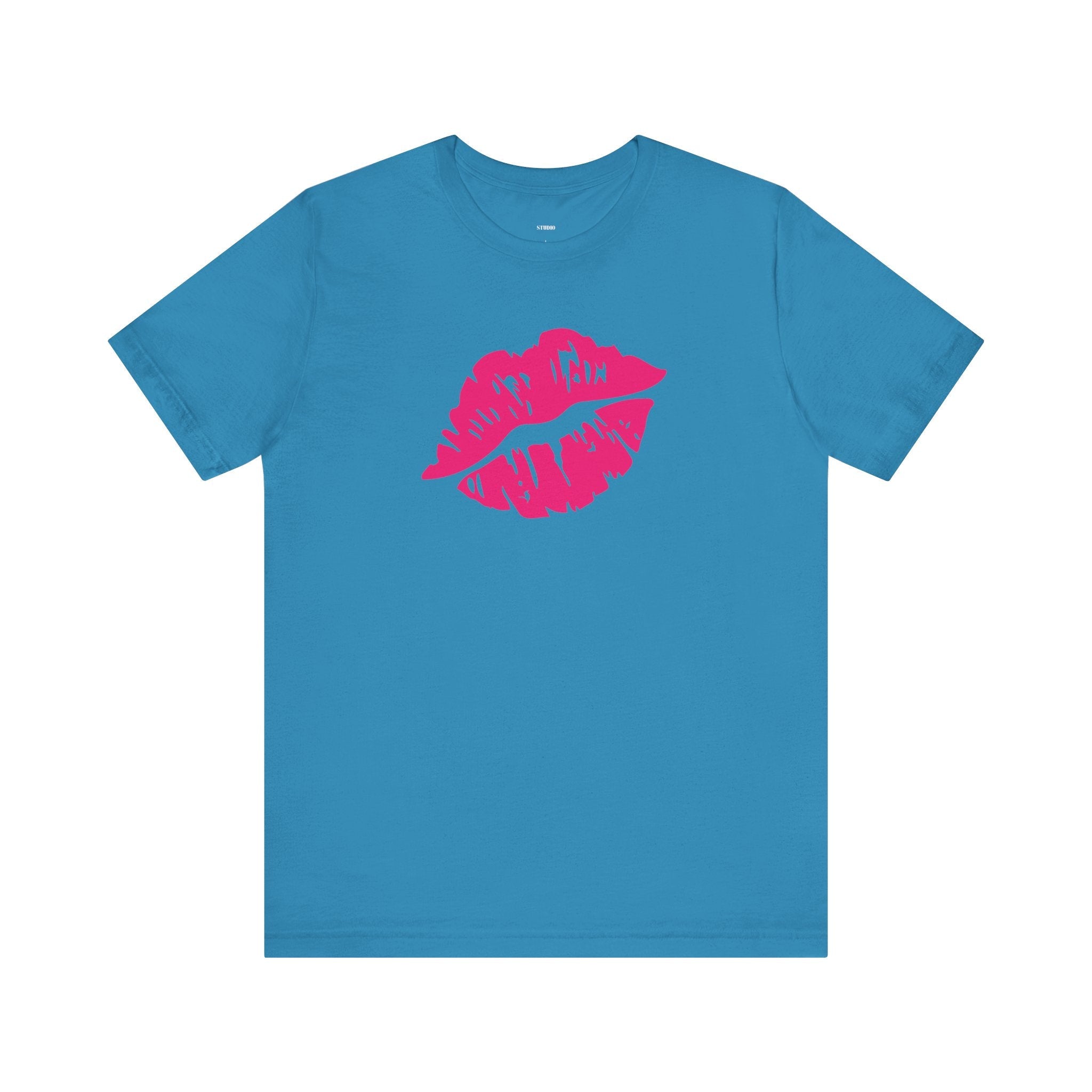 Blue unisex t-shirt with neon pink lip print graphic on front and "Fugitive." text graphic on back, made of soft cotton.