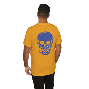 Man wearing mustard graphic tee shirts with large blue skull design on the back