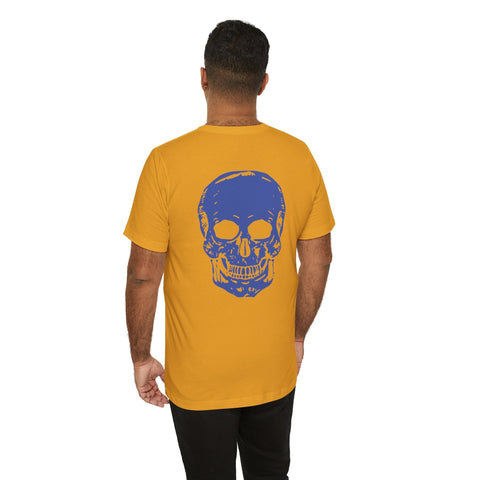 Man wearing mustard graphic tee shirts with large blue skull design on the back