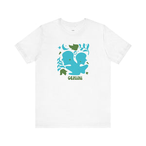 White Gemini astrology graphic tee with bold teal twin silhouettes and leafy celestial accents