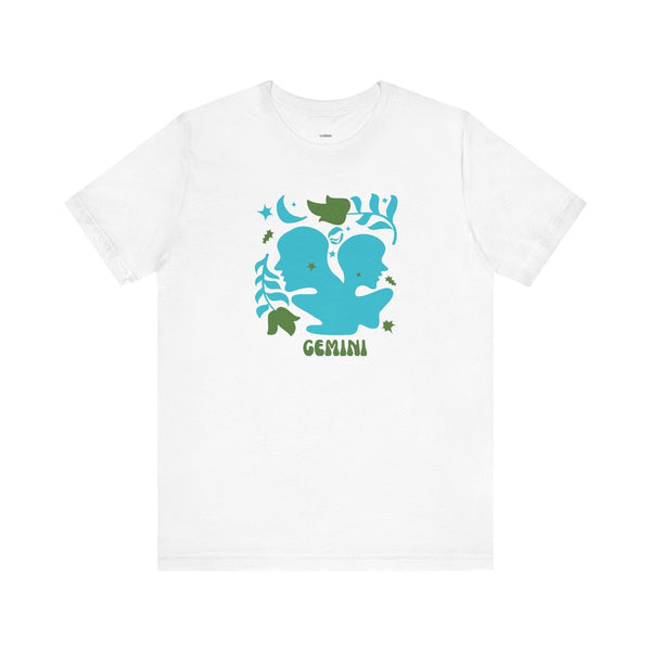 White Gemini astrology graphic tee with bold teal twin silhouettes and leafy celestial accents