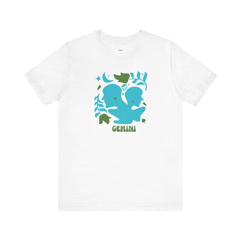 White Gemini astrology graphic tee with bold teal twin silhouettes and leafy celestial accents