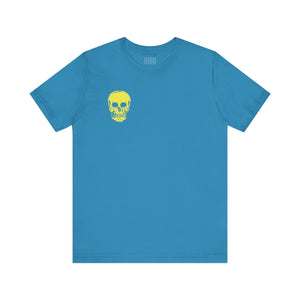 Blue graphic tee with small yellow skull on left chest, unisex cotton shirt from Fugitive Tees