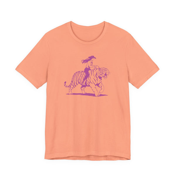 Cowgirl riding tiger graphic on retro style neon magenta print peach cotton tee