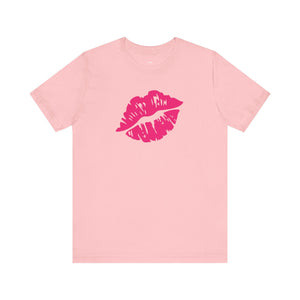 pink unisex tee with bold hot pink lip print graphic on front