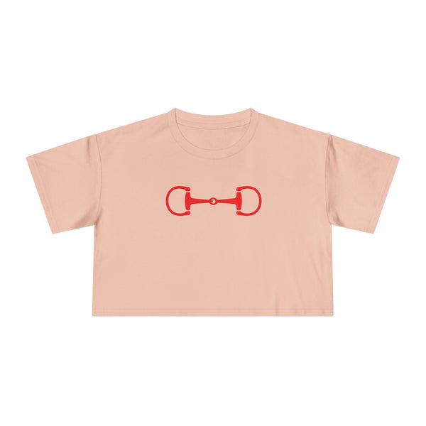 Cropped soft pink tee with red horse bit graphic and relaxed dropped shoulder design