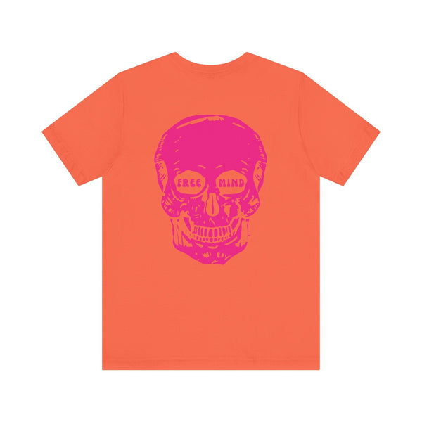Orange streetwear tee with oversized pink skull back print featuring "FREE MIND" in eye sockets