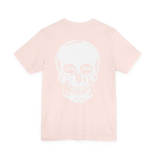 Light pink streetwear t-shirt with jumbo white skull graphic on back featuring "Live Free" text in eye sockets.