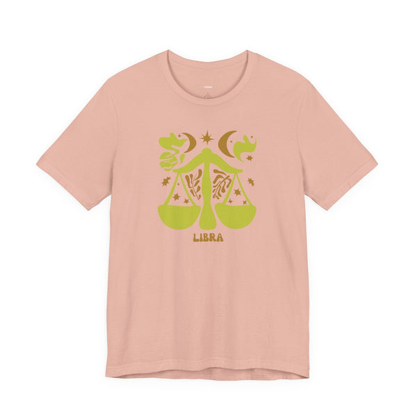 Pink Libra t shirt with green artistic balance scales and celestial zodiac design in unisex fit