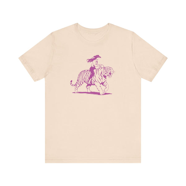 Beige cowgirl t-shirt with neon magenta graphic of cowgirl riding a tiger front print