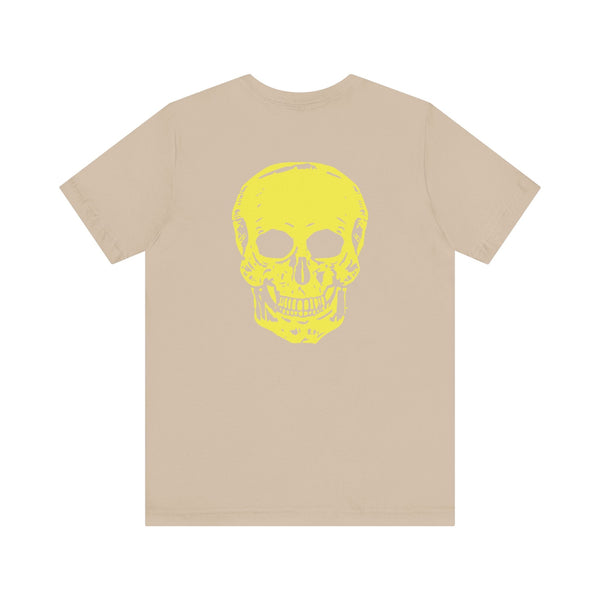Beige underground style tee with bold yellow skull graphic on back and mini chest print