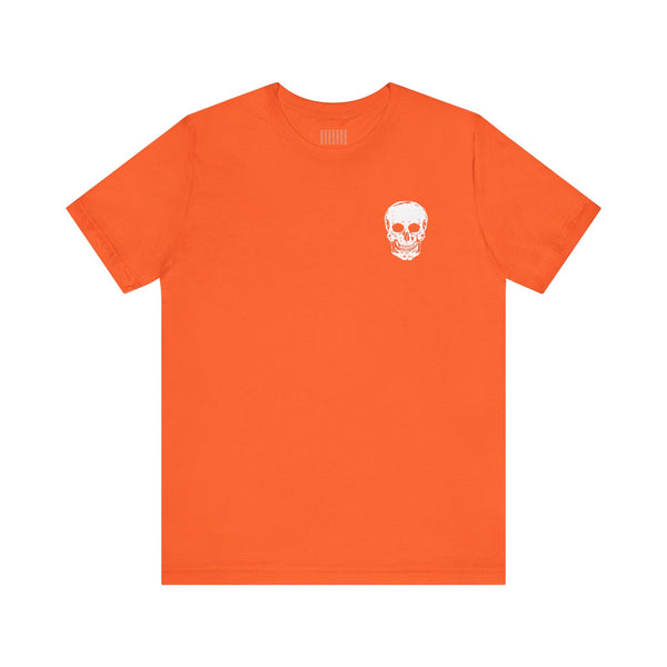 orange graphic tee with small white skull graphic on front chest