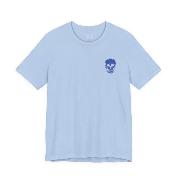 Light blue graphic tee shirt with small dark blue skull print on front left side