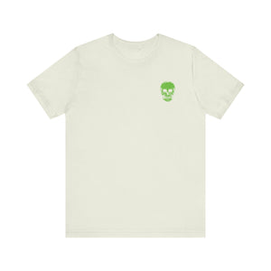 white streetwear t shirt with small green skull graphic on chest