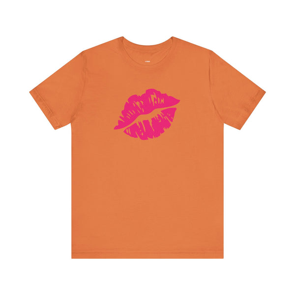 Unisex orange tee with vibrant hot pink lip print graphic on front
