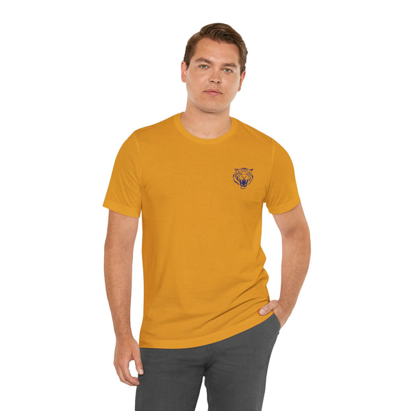 man wearing mustard yellow retro graphic tee with small roaring tiger head print on left chest