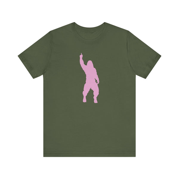 Olive green unisex bigfoot t shirt with a cheeky pink Sasquatch graphic mid-strut and hand raised.