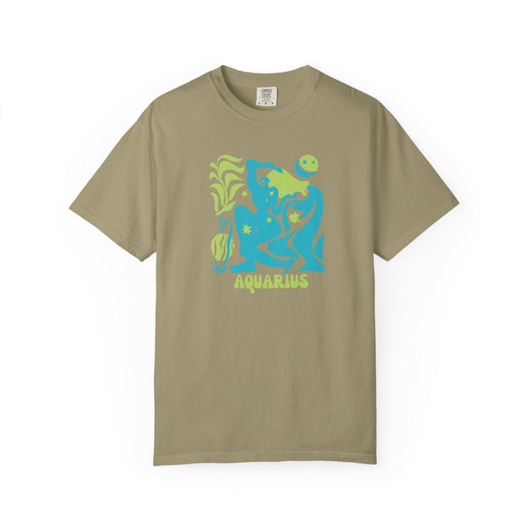 Aquarius Zodiac graphic tee in tan with vibrant aqua blue and green celestial design featuring water-bearer motif.