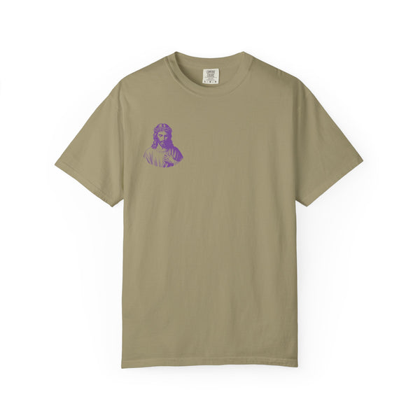 Purple mini Jesus graphic on front left of beige tee shirt by Sandra Oles