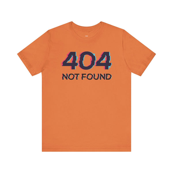 Orange unisex short sleeve tee with glitch-style "404 NOT FOUND" graphic on the front.