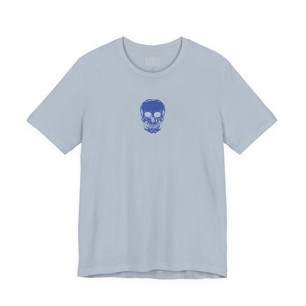 Light blue graphic t shirt with a small dark blue skull print centered below the collar, made from 100% combed cotton with a unisex fit.
