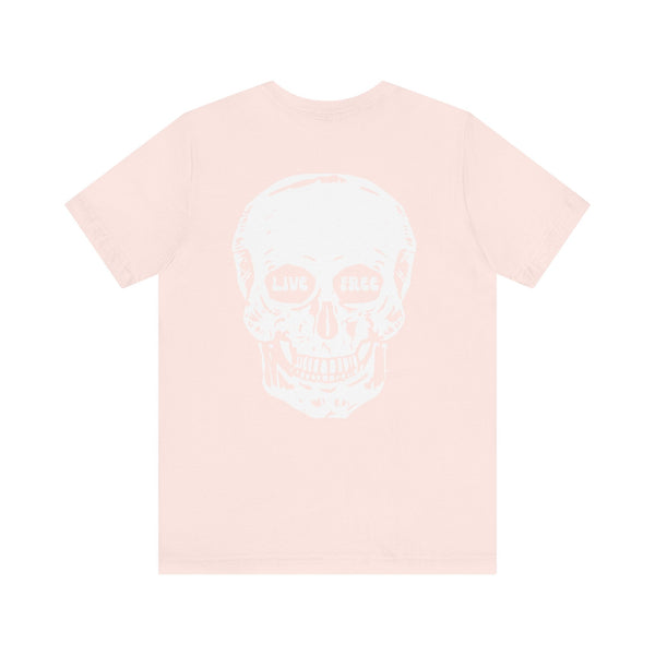 Streetwear graphic tee featuring a jumbo white skull back print with "Live Free" text, and a mini front skull design, in soft pink color.