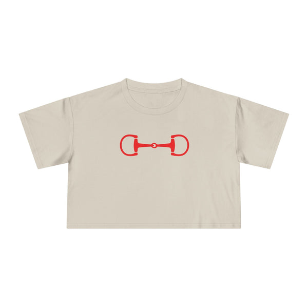 Beige cropped tee with bold red horse bit graphic, relaxed drop-shoulder fit, and soft cotton fabric.
