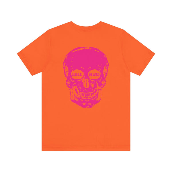 Orange statement streetwear t-shirt with oversized pink skull back print featuring "FREE MIND" in eye sockets, lightweight cotton design.