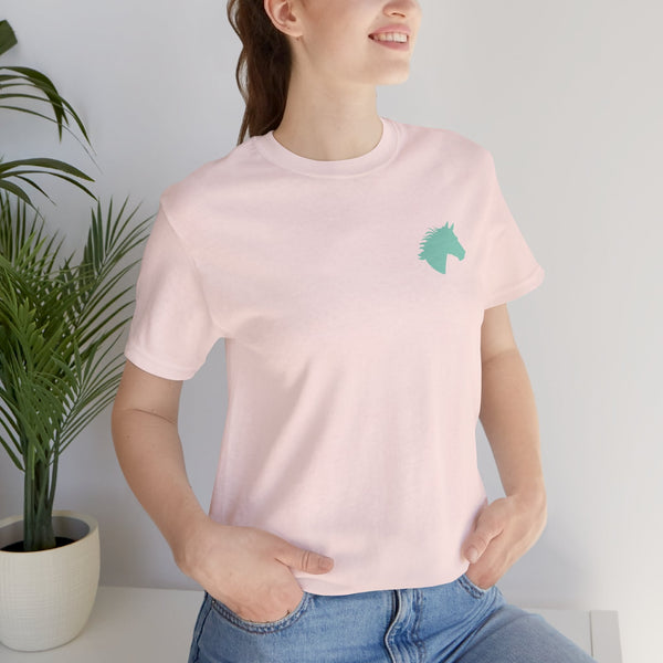 woman wearing pink t shirt with aqua horse head graphic print outdoors